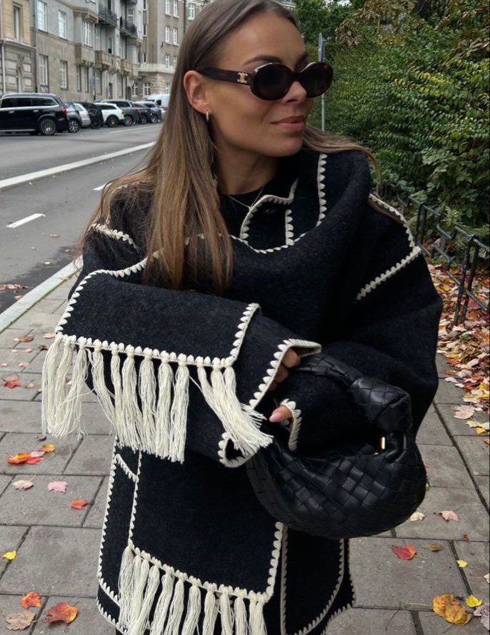 Girl wearing Tortiose Celine Triomphe sunglasses and black Toteme Scarf Jacket