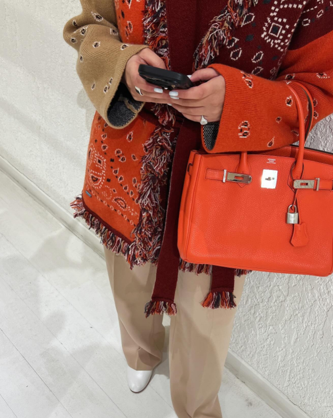 Alanui Cardigan in orange and burgundy bandana and an orange birkin 30