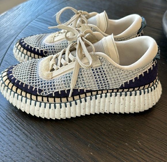 Chloe Nama Sneaker in Cosmic Blue on a table