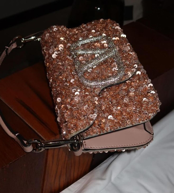 Valentino Pink Sequin Loco Bag on a table