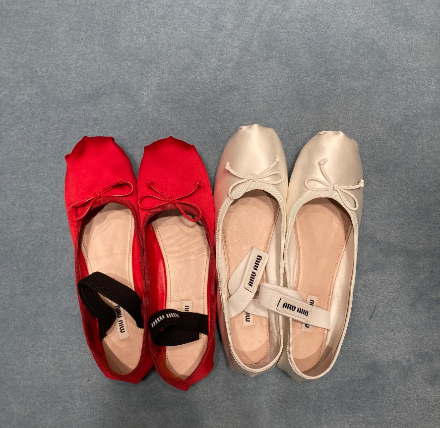 Miu Miu ballerinas in red and white satin on the floor